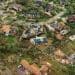 An aerial view of homes damaged by a hurricane.