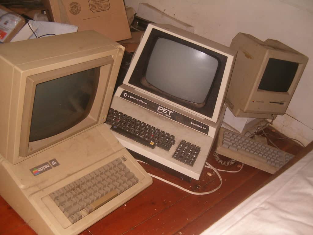 A collection of old computers, an example of items that commercial junk removal providers can deal with.